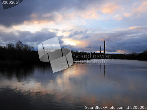 Image of Stormy sky over the night river.