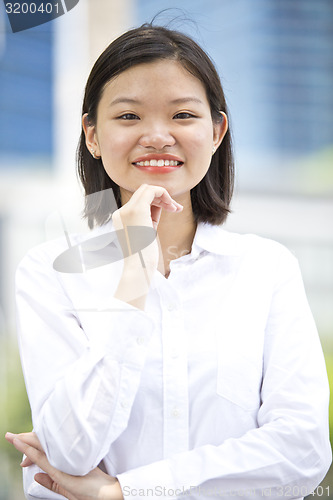 Image of Asian young female executive smiling portrait