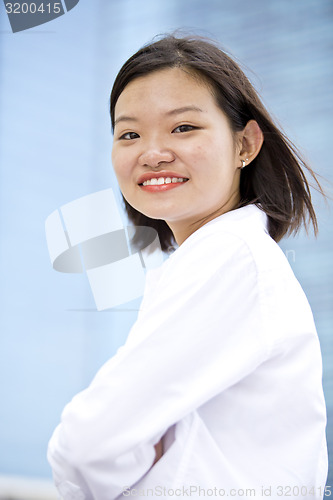 Image of Asian young female executive smiling portrait