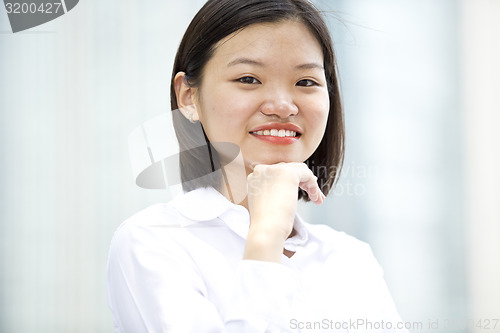 Image of Asian young female executive smiling portrait