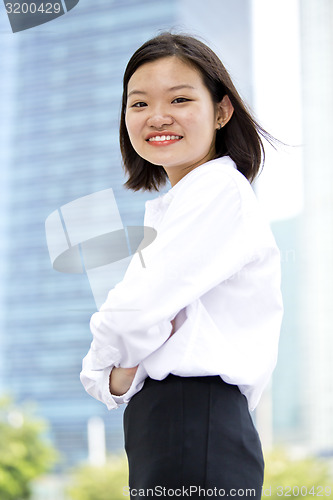 Image of Asian young female executive smiling portrait