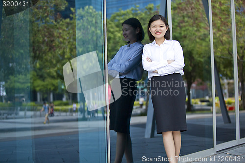Image of Asian young female executive smiling portrait