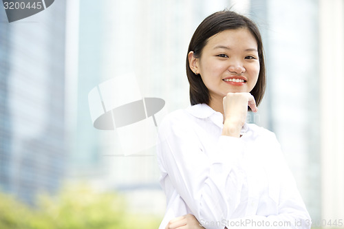 Image of Asian young female executive smiling portrait