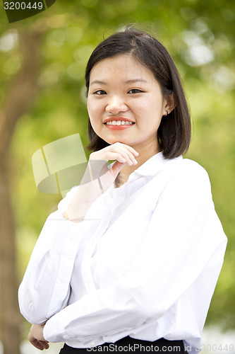 Image of Asian young female executive smiling portrait