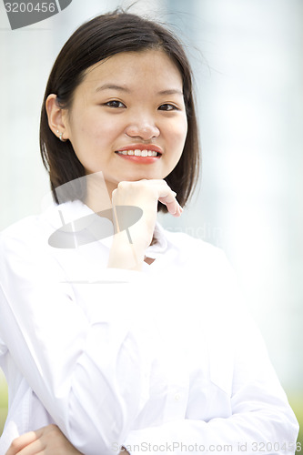 Image of Asian young female executive smiling portrait