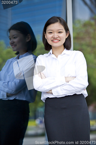 Image of Asian young female executive smiling portrait