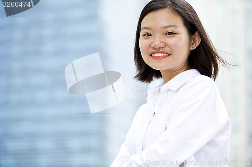 Image of Asian young female executive smiling portrait