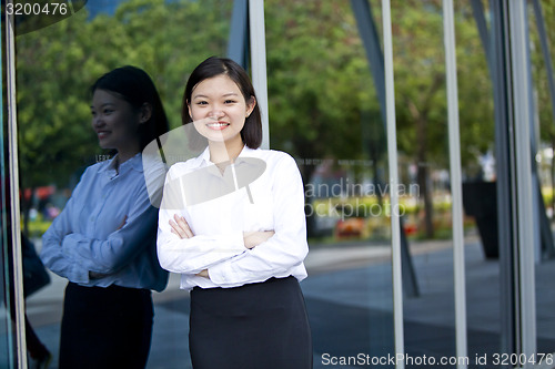 Image of Asian young female executive smiling portrait