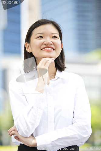 Image of Asian young female executive smiling portrait