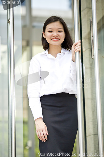Image of Asian young female executive smiling portrait