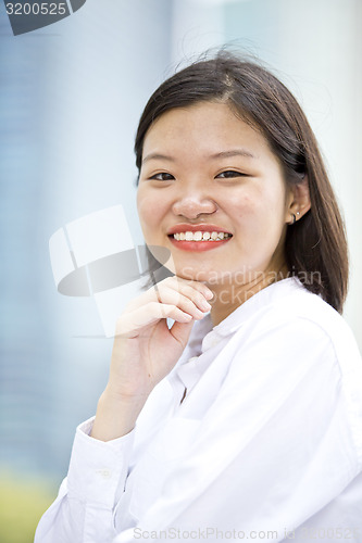 Image of Asian young female executive smiling portrait