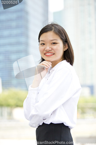 Image of Asian young female executive smiling portrait