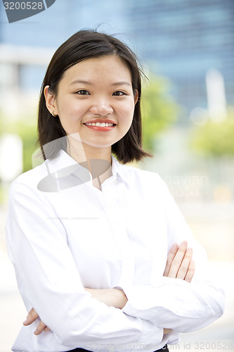 Image of Asian young female executive smiling portrait