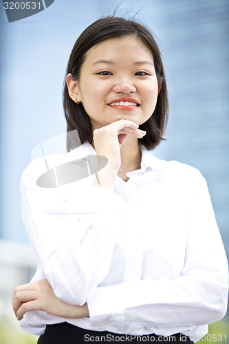 Image of Asian young female executive smiling portrait