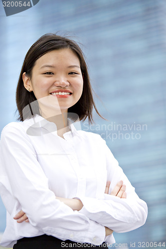 Image of Asian young female executive smiling portrait