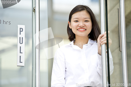 Image of Asian young female executive smiling portrait