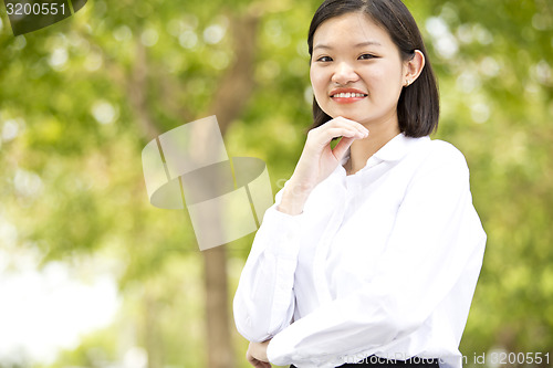 Image of Asian young female executive smiling portrait