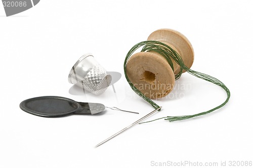 Image of Thread, thimble and needle