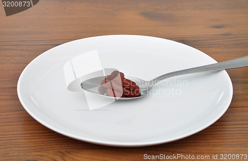 Image of Spoon with tomato puree