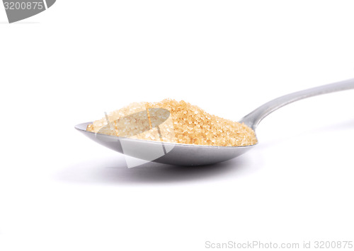 Image of Brown cane sugar on spoon