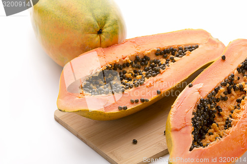 Image of Papaya Halved With A Longitudinal Cut