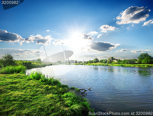 Image of Sun over river