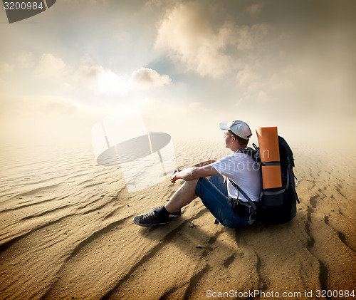 Image of Tourist in sand desert