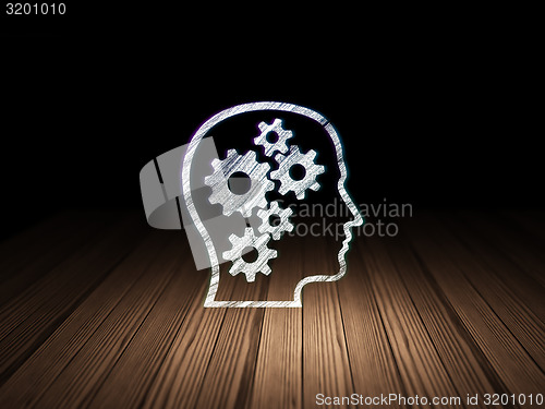 Image of Finance concept: Head With Gears in grunge dark room