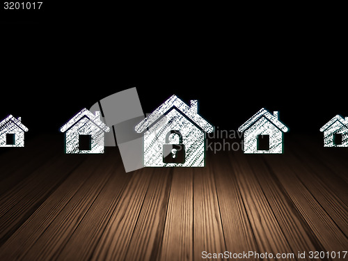 Image of Security concept:  home icon in grunge dark room