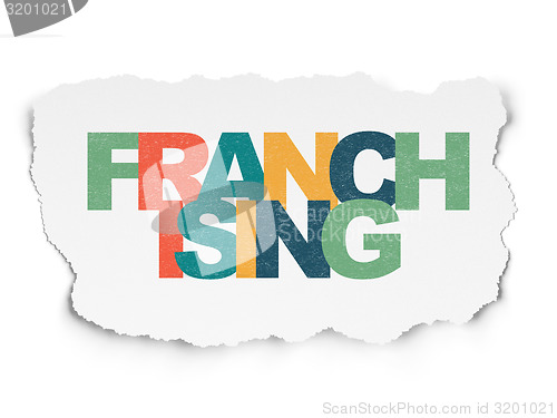Image of Finance concept: Franchising on Torn Paper background