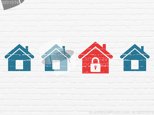 Image of Security concept: red home icon on wall background