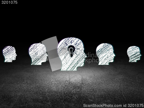 Image of Business concept:  head with light bulb icon in grunge dark room