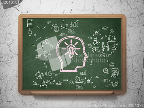 Image of Finance concept: Head With Lightbulb on School Board background