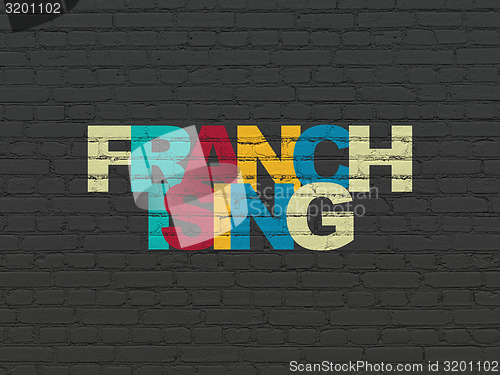 Image of Business concept: Franchising on wall background
