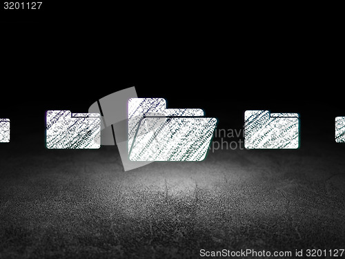 Image of Business concept:  folder icon in grunge dark room