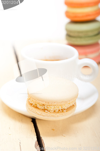 Image of colorful macaroons with espresso coffee 