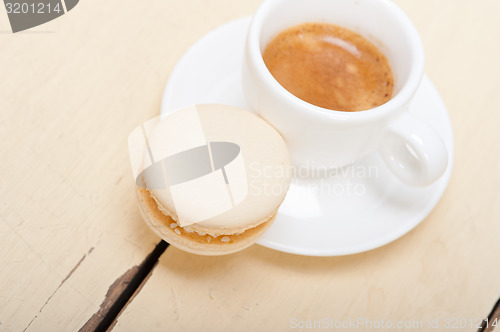 Image of colorful macaroons with espresso coffee 
