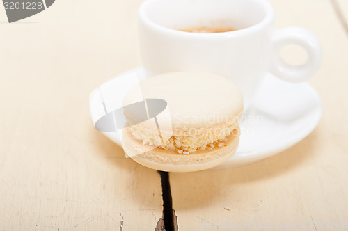 Image of colorful macaroons with espresso coffee 