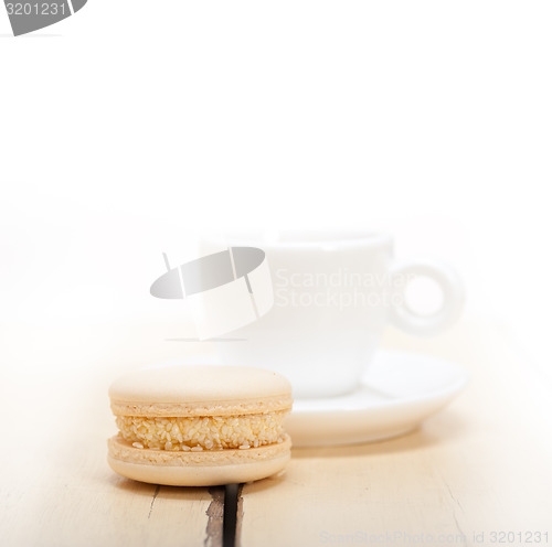 Image of colorful macaroons with espresso coffee 