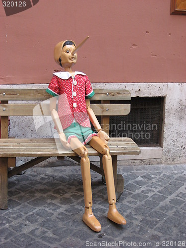 Image of Doll on a bench