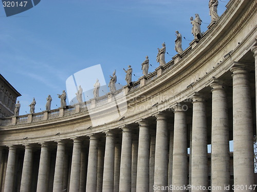 Image of Bernini's monumental colonnade, topped with statues of saints