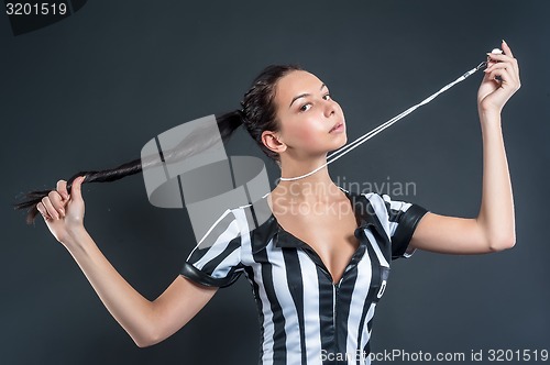 Image of Attractive Soccer Referee holding whistle