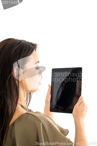 Image of Attractive woman using a tablet computer