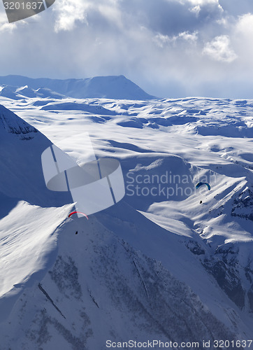 Image of Speed flying in winter evening mountains
