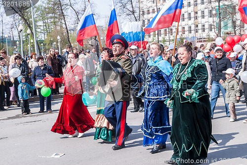 Image of Cossack with women sings songs on procession
