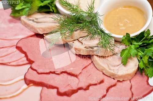 Image of meat, ham and sauce