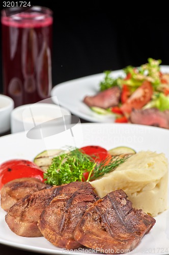 Image of tongue with grilled vegetable