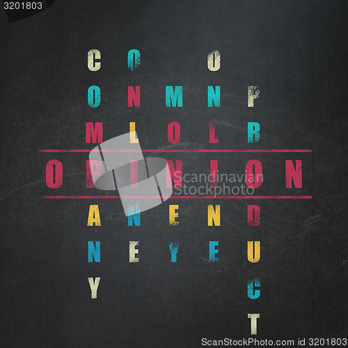 Image of Marketing concept: word Opinion in solving Crossword Puzzle