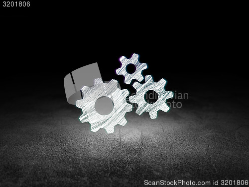Image of Advertising concept: Gears in grunge dark room