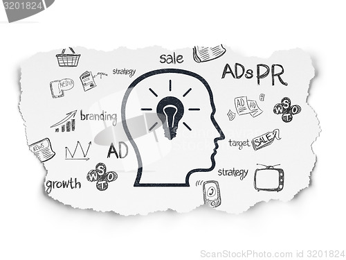 Image of Advertising concept: Head With Lightbulb on Torn Paper background